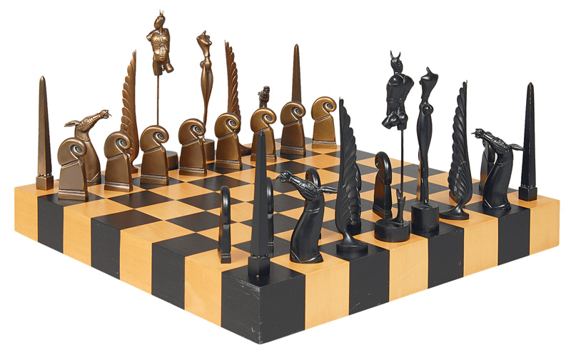 A chess game with board and bronze figures