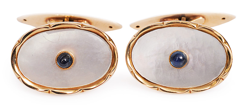 A pair of mother-of-pearl cufflinks