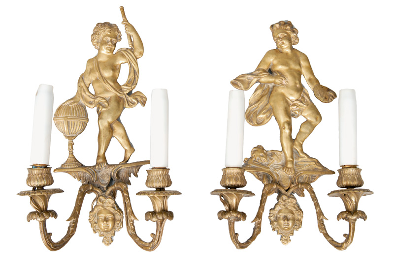 A pair of wall lights with putto allegories "Paintings" and "Astronomy"