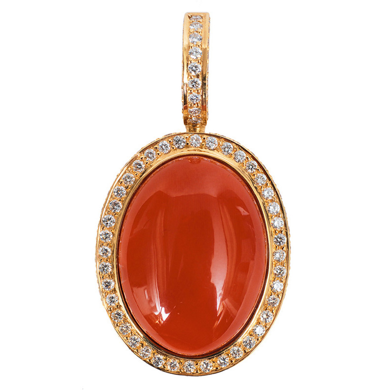 A coral diamond pendant