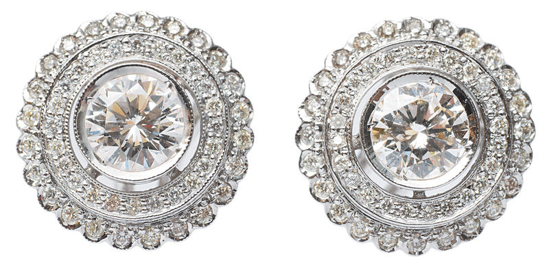 A pair od solitaire earrings with diamonds