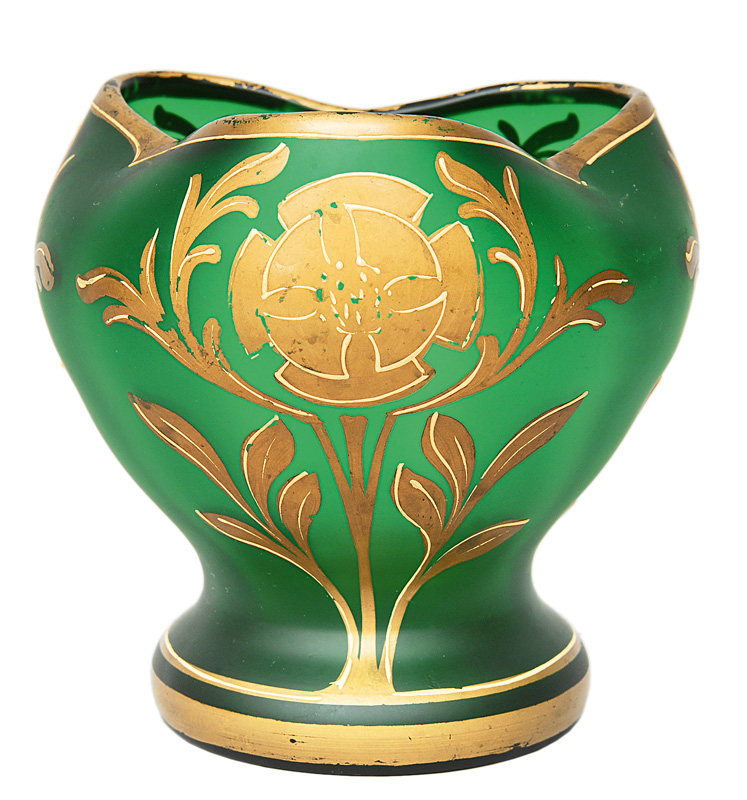 A vase with floral gold painting