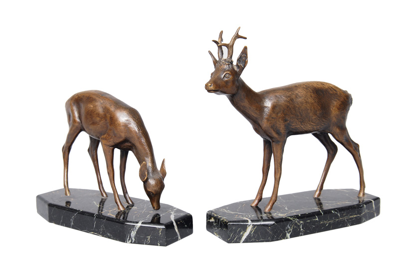 A pair of bronze figures "Roebuck" and "Browsing doe""
