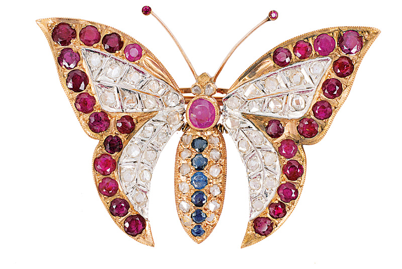 A butterfly brooch with rubies, diamonds and sapphires