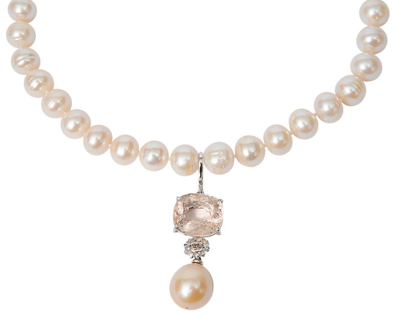 A pearl necklace with a morganite diamond pendant