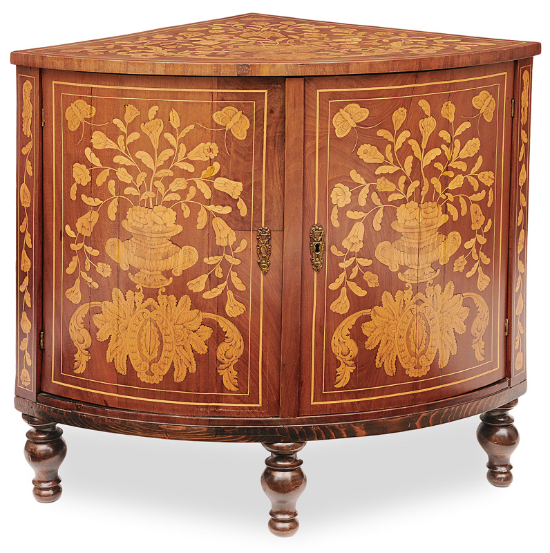 A corner cabinet with floral marqueterie