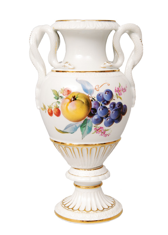 An amphora vase with fruit painting