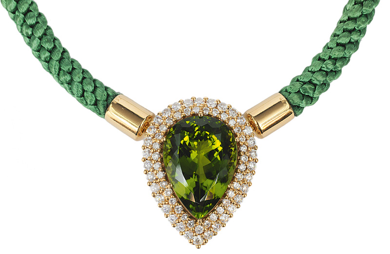 A highquality, dropshaped peridot pendant with diamonds