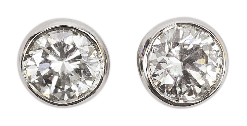 A pair of single stone diamond earstuds