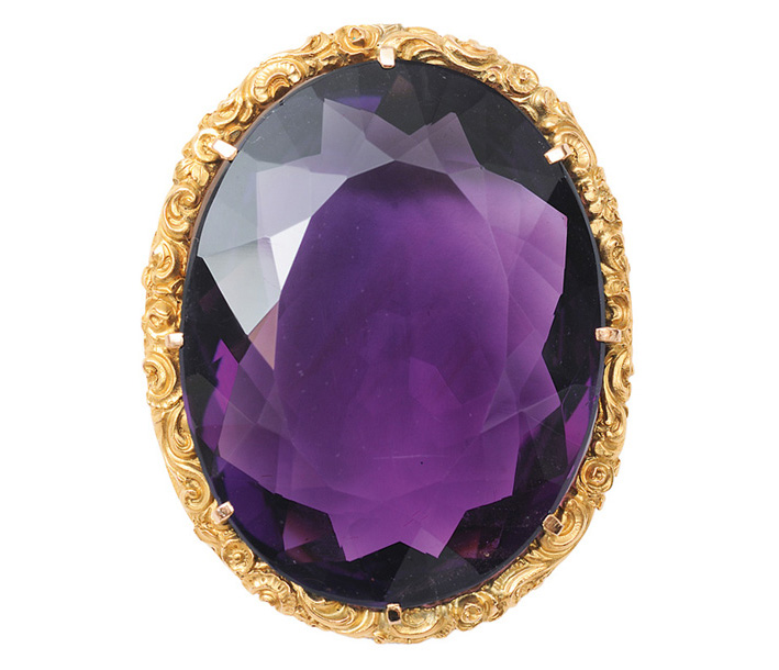 A large amethyst brooch