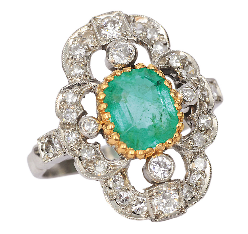 An emerald diamond ring