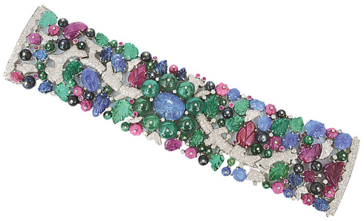 An extraordinary, floral ruby emerald sapphire bracelet in the style of Art-déco