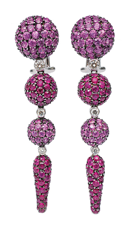A pair of long earclips with rubies and pink sapphires