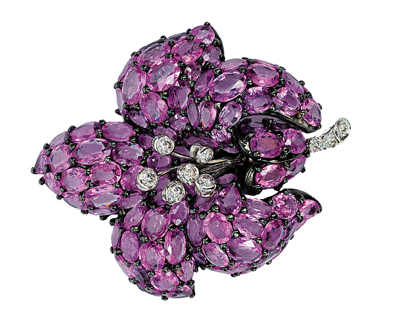 A flowershaped brooch with pink sapphires and diamonds