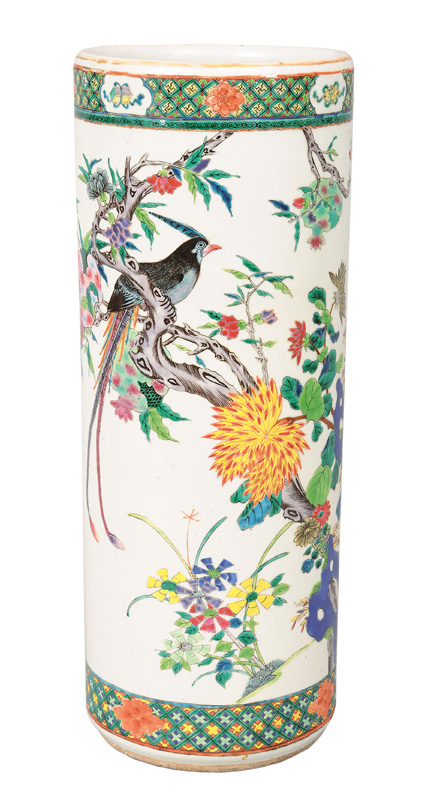 A tall cylindrical vase with bright flower painting