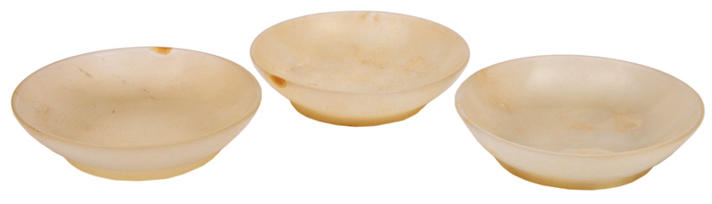 A set of 3 small jade bowls
