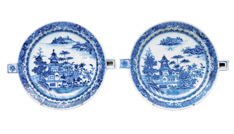 A pair of warming dishes with garden scene