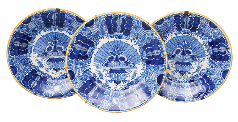 A set of 3 plates with peacock decor