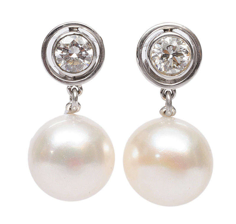 A pair of pearl diamond earrings