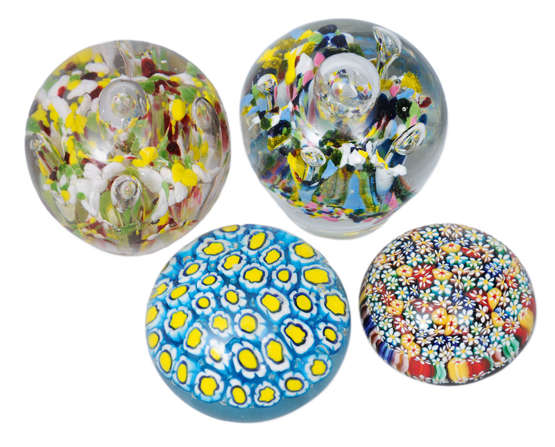 A set of four paperweights