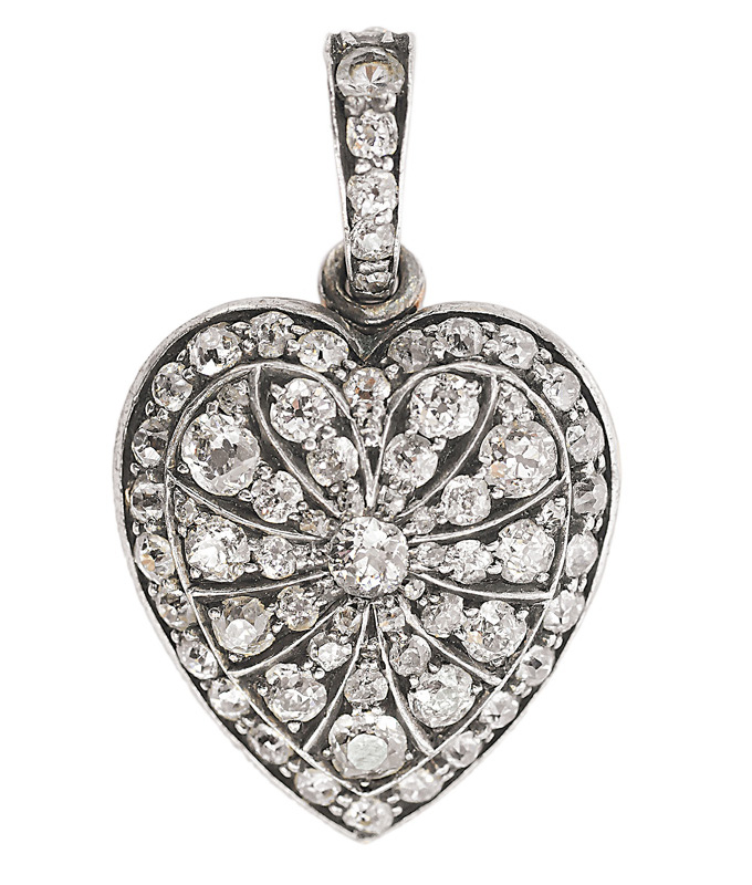 A diamond pendant in the shape of a heart