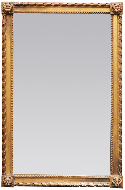 A mirror with Louis-Seize ornaments