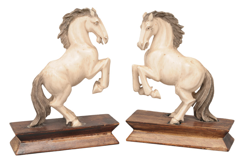 A pair of ivory horses