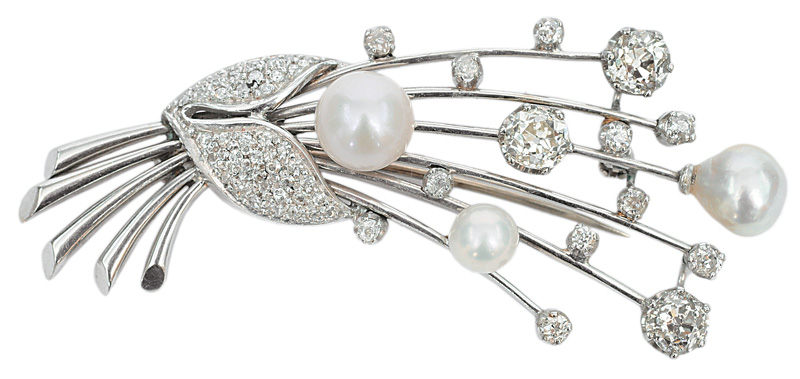 A diamond brooch with pearls