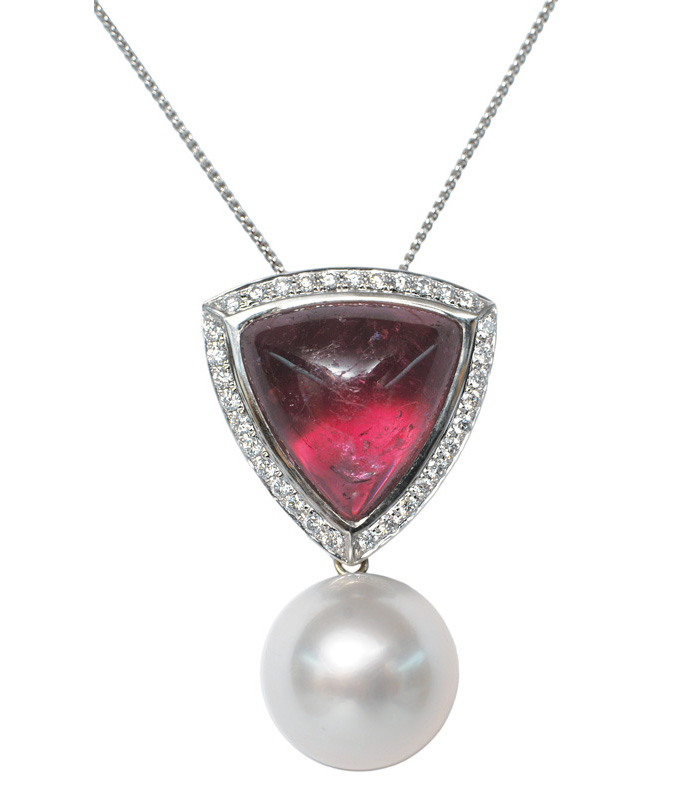 A rubelith diamond pendant with one Southsea pearl