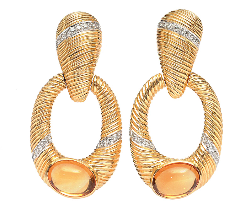 A pair of long golden earrings with citrines and diamonds