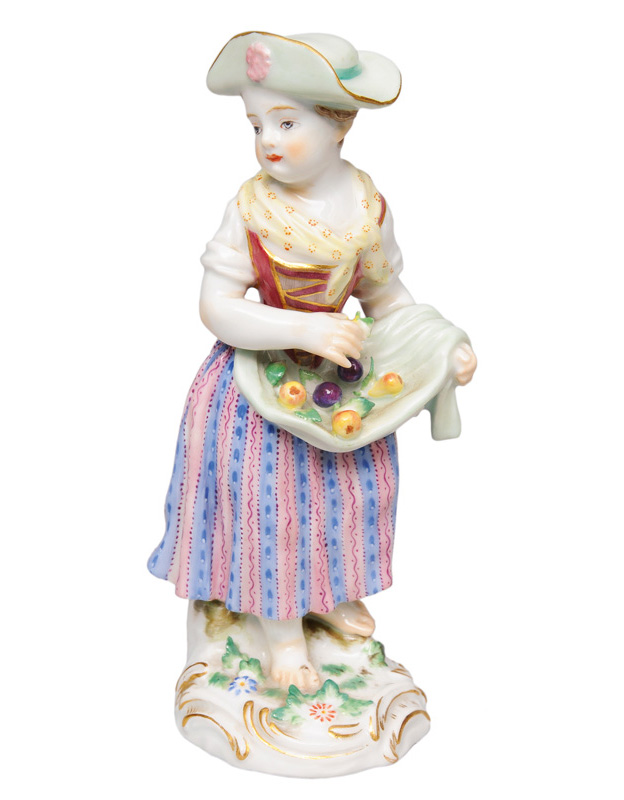 A figurine "Gardener"s child with fruits"