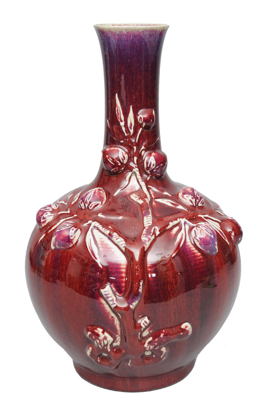 A large vase with flambé glaze and peach relief