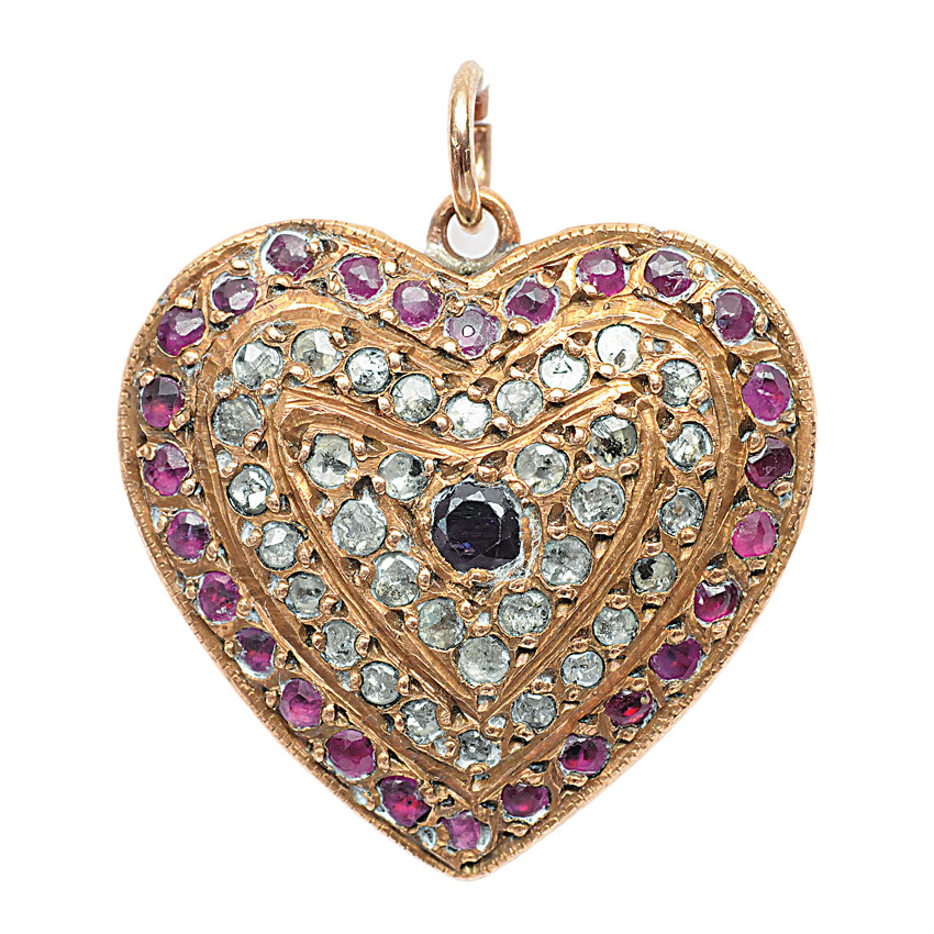 A diamond ruby pendant in the shape of a heart