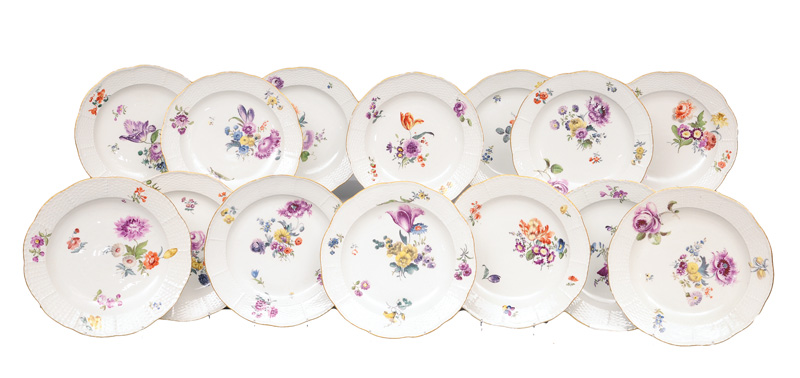 A set of 14 dinner plates with flower painting