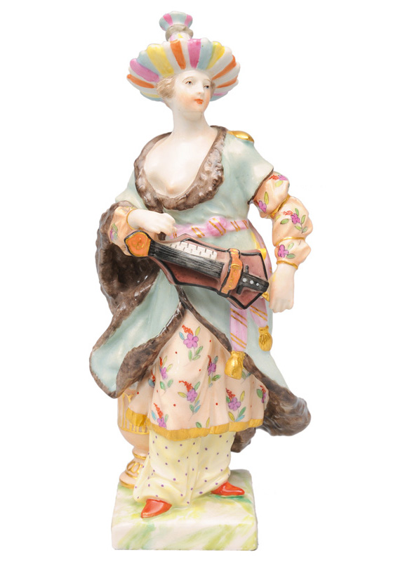 A figurine "Chinese woman with hand organ"