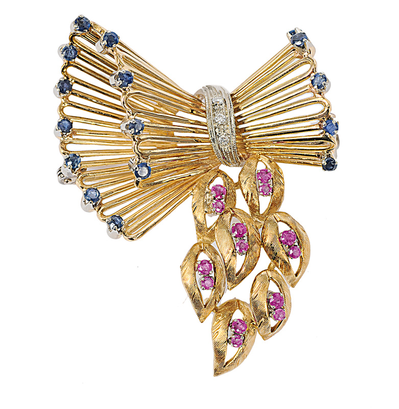 A golden brooch with sapphires and rubies