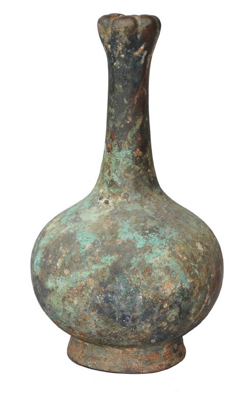 A tall bronze bottle vase with garlic head