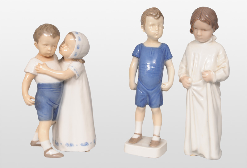 Three expressive children figurines