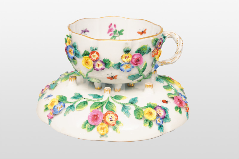 A cup with plastical decoration