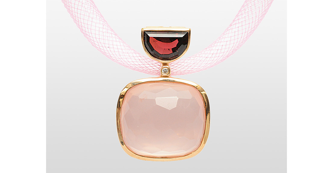 A large rose quartz rhodolit pendant with nylon necklace