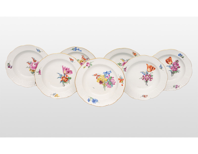 A set of 5 soup plates with flower painting
