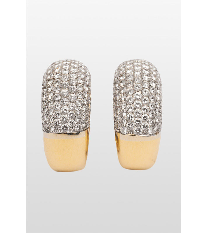 A pair of high carat diamond earrings