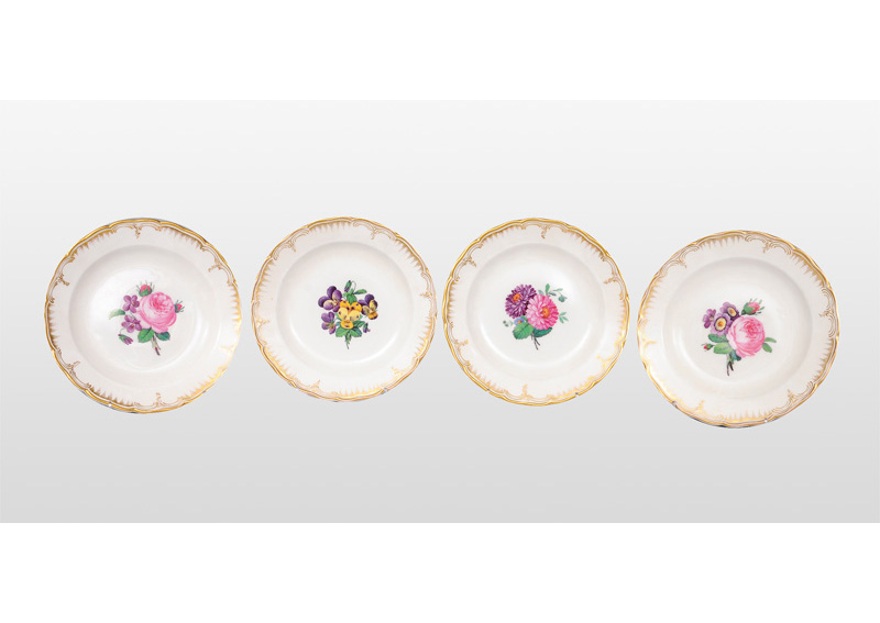 Four plates with flower bouquets