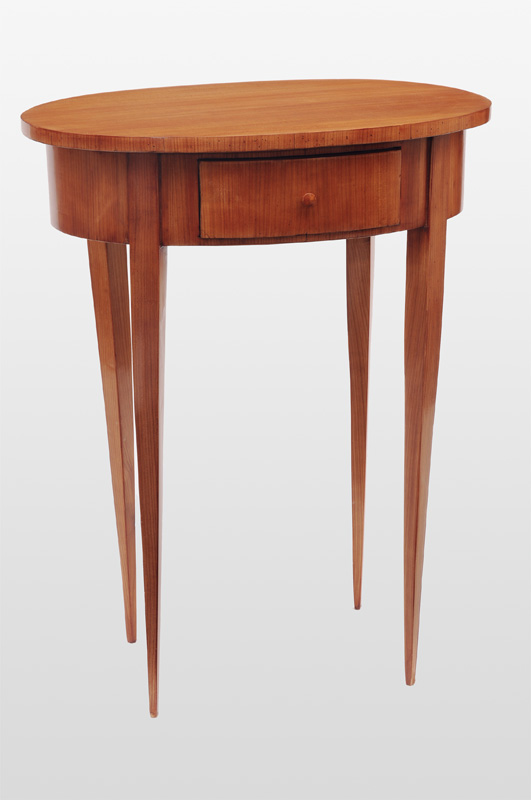 An oval side table in the style of Biedermeier