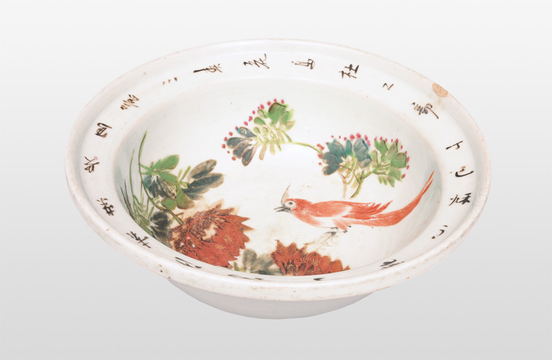 A large bowl with bird on a peony branch