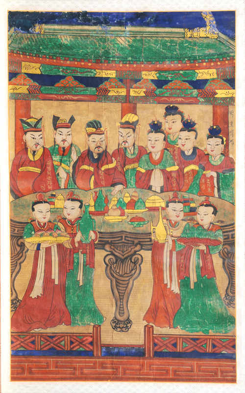 A framed scroll painting of an ancestor group