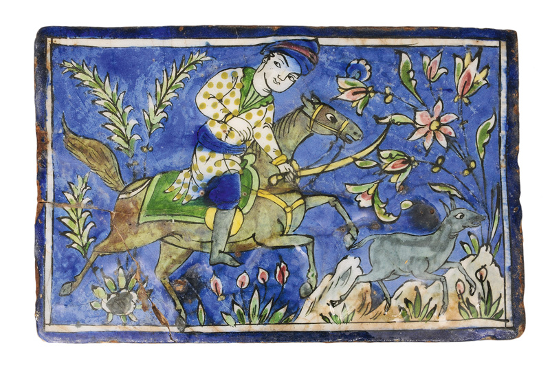 A large Qajar tile with hunting scene