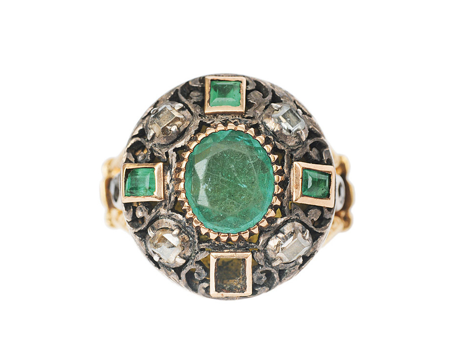 A baroque emerald diamond ring