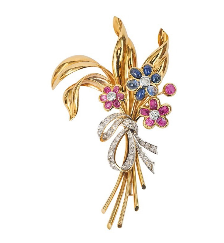 A large flower brooch with precious stones