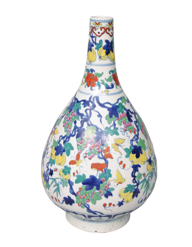An exceptional Doucai bottle vase with grapes and butterflies